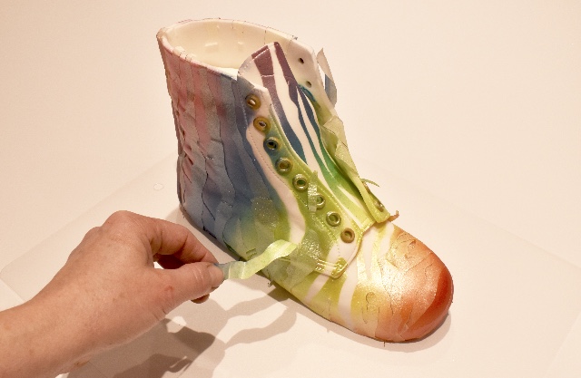 Use Rainbow dust metallic food paint and airbrush each colour starting with the metallic red and work the colours up the boot blending each colour to the next creating a multicolour rainbow effect. Once dry peel off the masking tape to reveal the Rainbow Zebra design.