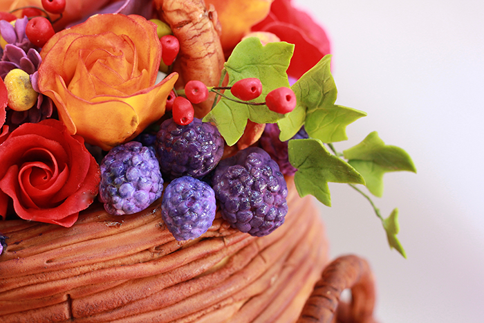 For the top tier, create an assortment of gum paste flowers and berries.
