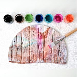 Create a marbled effect using different coloured pastes